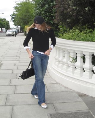 @camillecharriere wearing silver flats with jeans and a jumper