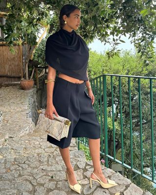 fashion influencer Sandra Shehab wearing a ruched neckline Jacquemus top