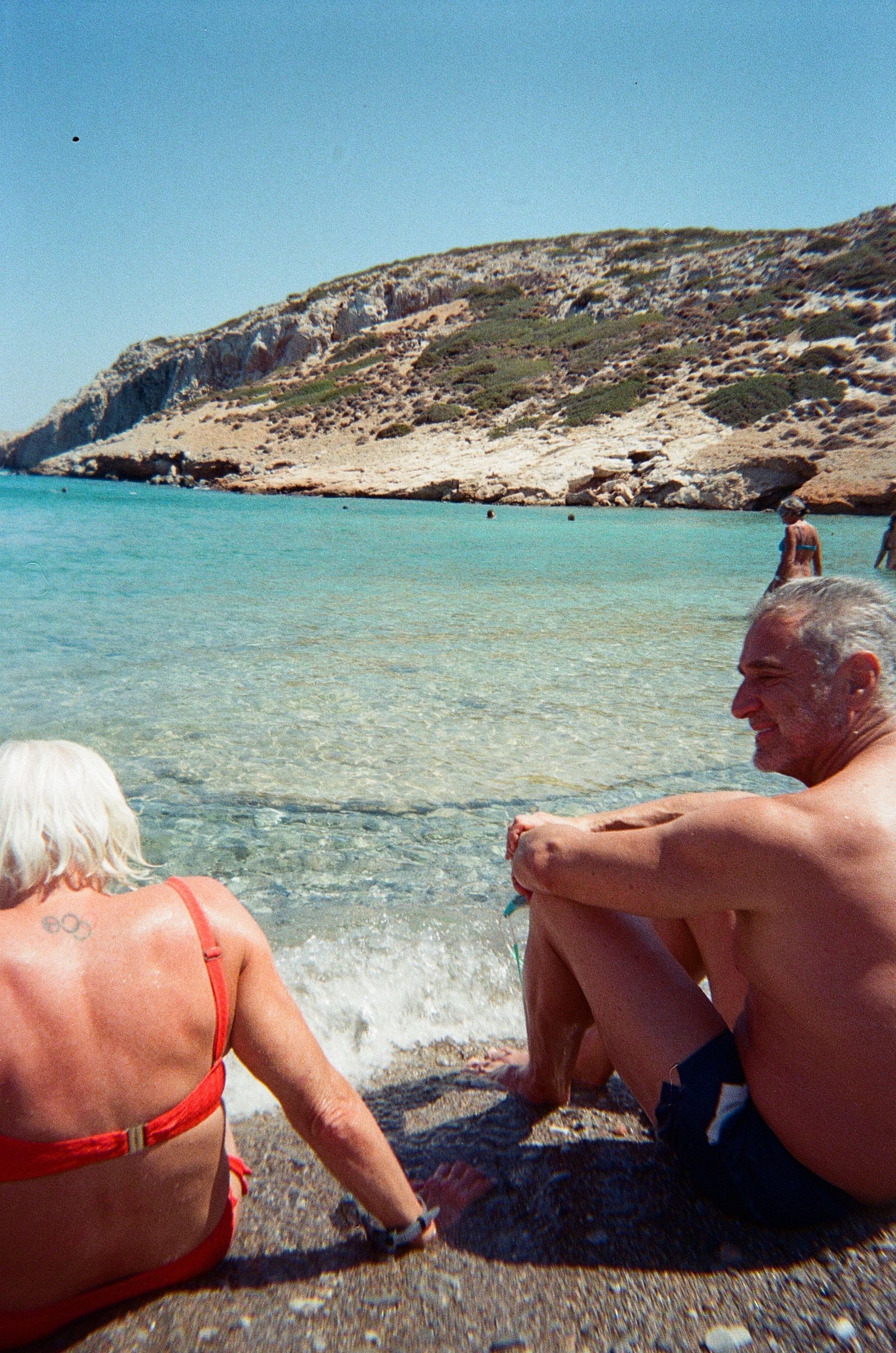 Image may contain Rock Back Body Part Person Beach Coast Nature Outdoors Sea Shoreline Water and Clothing