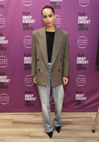 Zoe Kravitz wears short jacket and wide leg jeans