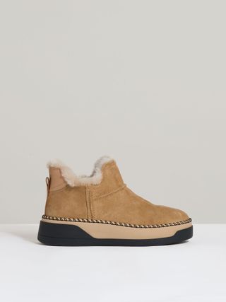 Shearling-Lined Suede Ankle Boots in Tan