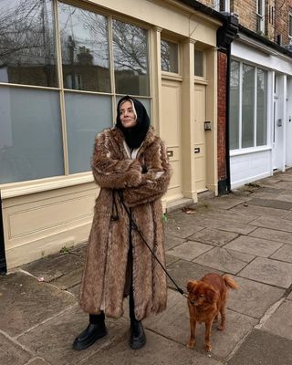 Fur coat and chelsea boots on Lucy