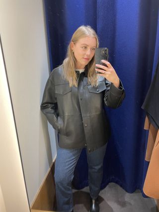 Woman wears leather jacket from Whistles