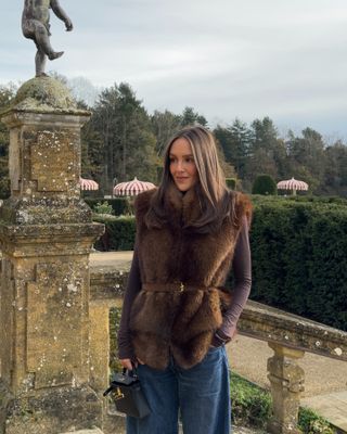 Emma Rose Leger in a fur vest and Aureum belt