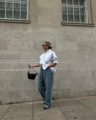 Alexis Foreman in white shirt and jeans