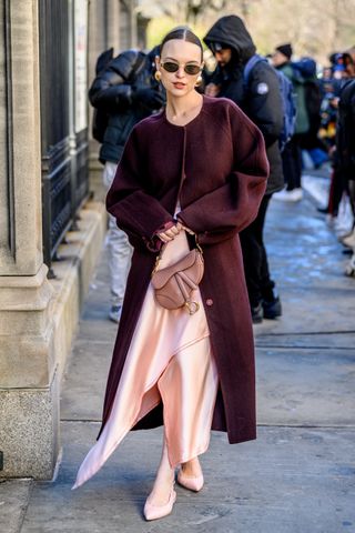 Powder pink outfit and burgundy coat