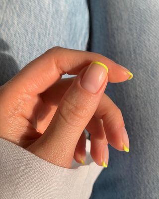 @raelondonnails neon yellow French tip nails