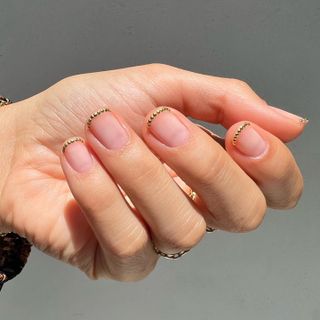 @betina_goldstein embellished French tip nails