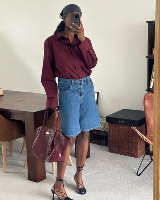 Nlmarilyn in burgundy shirt and bag and denim Bermuda shorts