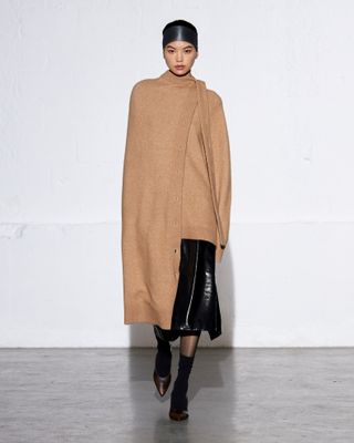 Tibi fall winter 2024 vinyl skirt and jumper and matching scarf.