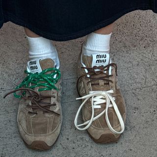 Influencer wears Miu Miu trainers with white socks.