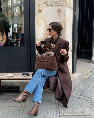 French woman in brown coat.