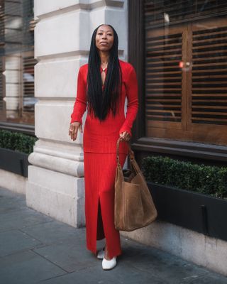 Influencer wish list 2025: @thandimaq wears a red co ord and suede bag