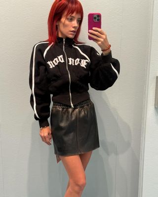 Lily Allen wears a miniskirt.