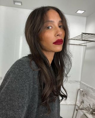 Tylynn Nguyen wearing red lipstick with no mascara