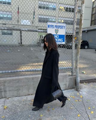 Fashion influencer @mimixn wearing a chic long wool winter coat.