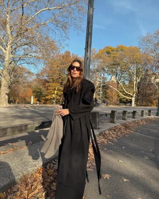 Fashion influencer @jen_wonders wearing a chic long wool winter coat.