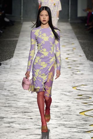 Model wears a lilac dress on the Versace spring/summer 2025 runway.