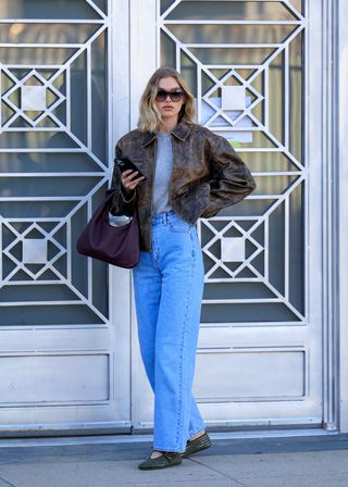 Elsa Hosk wearing jeans and Mary Janes.