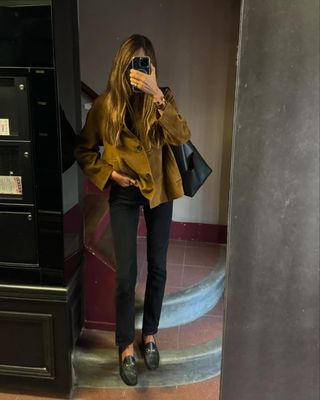 @saraloura wearing black skinny jeans, a suede blazer and black loafers