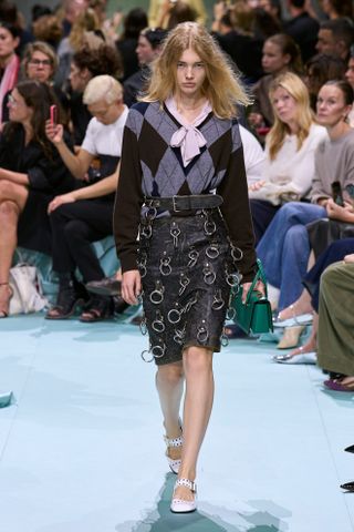 Model wears a pencil skirt on the Prada spring/summer 2025 runway.