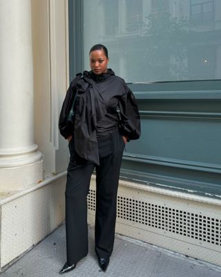 Influencer wearing an all-black outfit in NYC