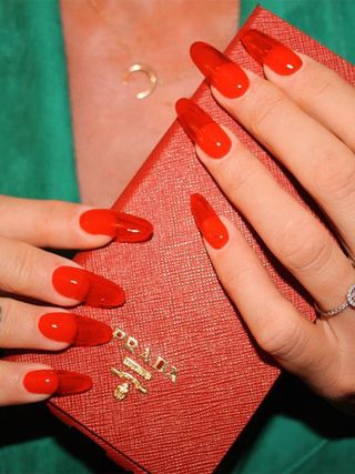 A cherry red jelly manicure by Imarni Nails.