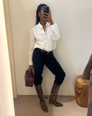 Woman wears white shirt, black jeans and leopard print boots