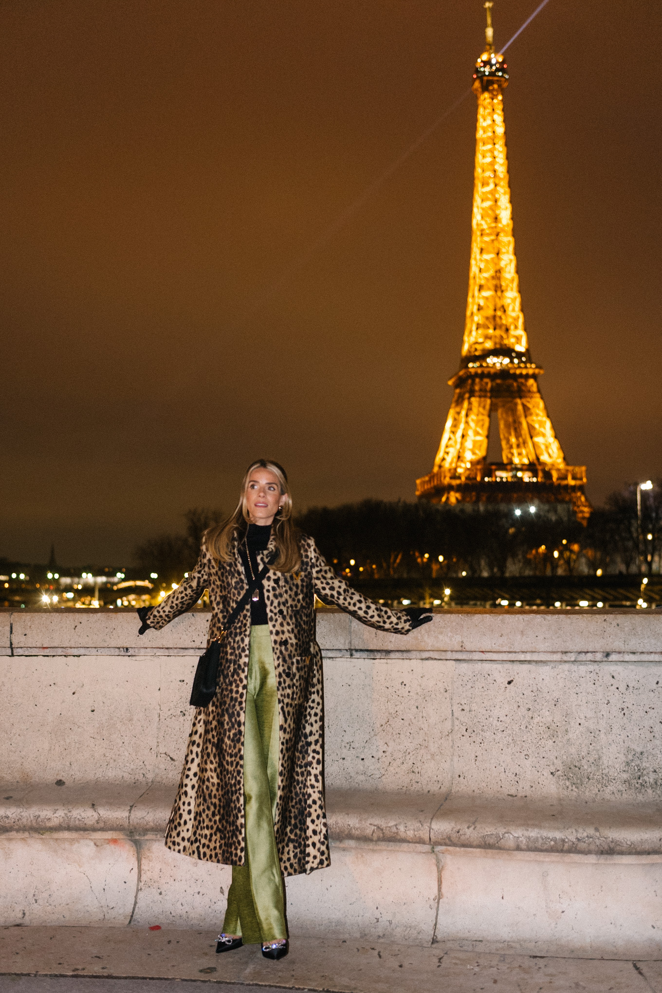 leopard winter coat green satin pants black pumps black leather bag