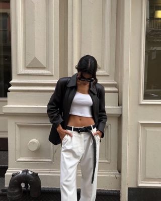 Jen Ceballos wearing all white outfit with jeans.