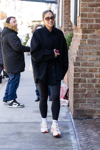 Photo of Tate McRae wearing black leggings in New York.