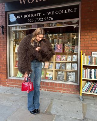 @camillecharriere wearing vintage blue jeans, faux fur jacket and patent heels