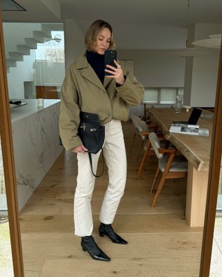 Anouk Yve wearing cream-colored jeans