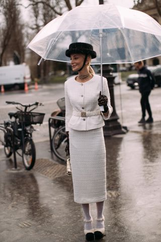 Paris Couture Fashion Week Street Style. Show attendee wears a peplum jacket.