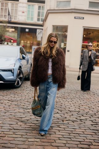 Photo of Scandi woman in winter street style during Copenhagen Fashion Week Fall-Winter 2025.