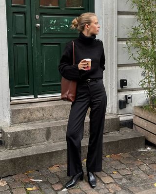 An image of influencer @claradyrhauge wearing shoes with satin trousers.