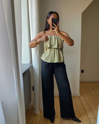 Top Trends 2025: @femmeblk wears a pleated bandeau top