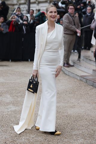 Kelly Rutherford attending the Schiaparelli haute couture show in Paris wearing a white gown.