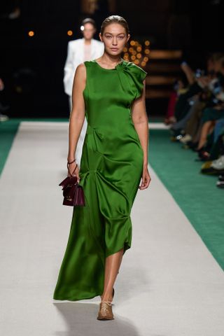 Gigi Hadid on the Victoria Beckham runway in emerald green dress