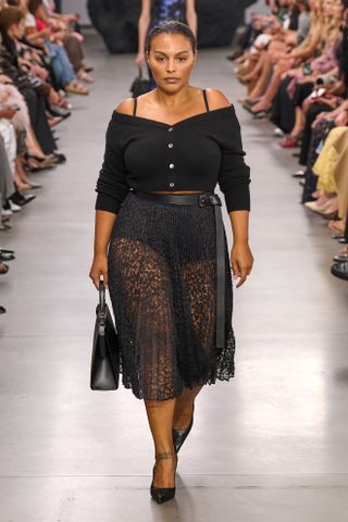 Model wears a lace skirt on the Micheal Kors spring/summer 2025 runway.