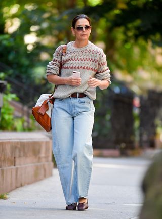 Katie Holmes wearing a Fair Isle sweater and light-wash jeans.