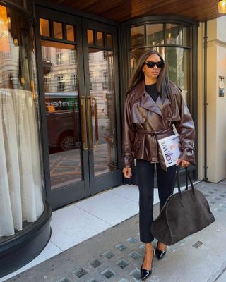 Woman in slim-fitting pants and leather jacket