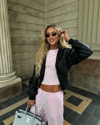 Woman in light pink top and pants