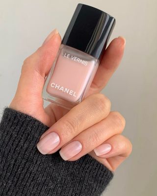 A woman wearing the Chanel Ballerina nail polish