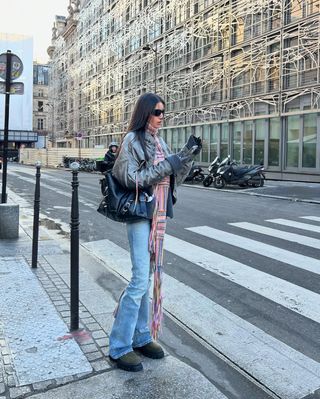 woman wearing light wash flare jeans