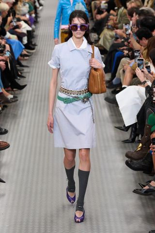 Model wears layered belts on the Miu Miu spring/summer 2025 runway.