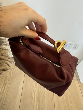 An image of a liffner bag in burgundy