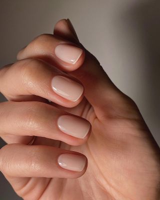 Short pink squoval nails with white French tips