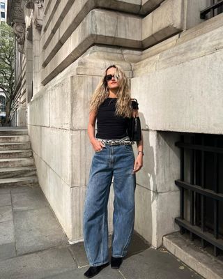 Eliza Huber wearing barrel jeans with an off-the-shoulder top