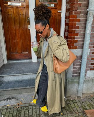 Trench coat, jeans, and sneakers outfit